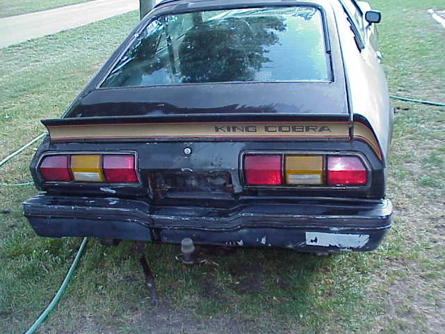 Rear view of a 1978 Ford Mustang II King Cobra with a spoiler and "KING COBRA" text on the trunk lid