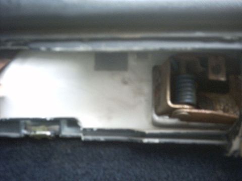 1991 Ford Crown Victoria LTD - Close-up of a car's interior door latch mechanism, showing internal components.