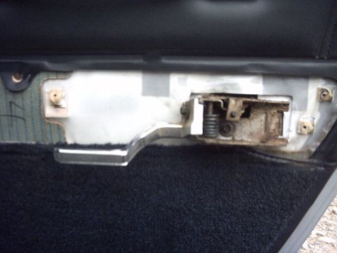 1991 Ford Crown Victoria LTD - The interior door handle mechanism shows signs of rust and wear, indicating a need for repair or replacement.