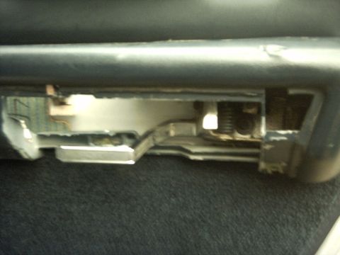 1991 Ford Crown Victoria LTD - Close-up of a car's interior door latch mechanism, showing internal components.