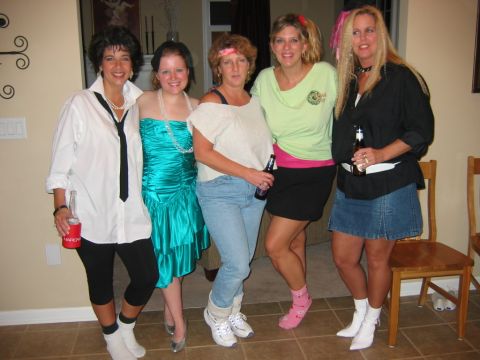 1985 Ford LTD Crown Victoria - Women dressed in 1980s fashion pose together at a party.