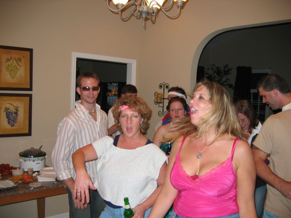 People dancing and socializing at an indoor party