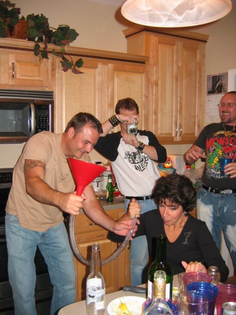 1985 Ford LTD Crown Victoria - Friends gather for a party, engaging in a fun activity with a beer funnel.