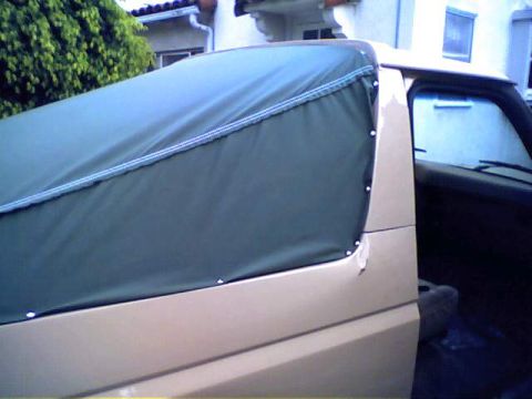 1994 Ford Bronco - This 1994 Ford Bronco is equipped with a dark green soft top cover.