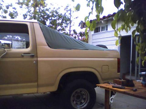 1994 Ford Bronco - This vehicle has a removable soft top, covering the rear cargo area.