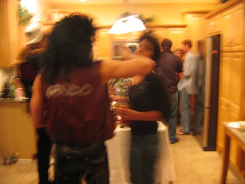 1985 Ford LTD Crown Victoria - People socialize in a kitchen during a party in October 2005.
