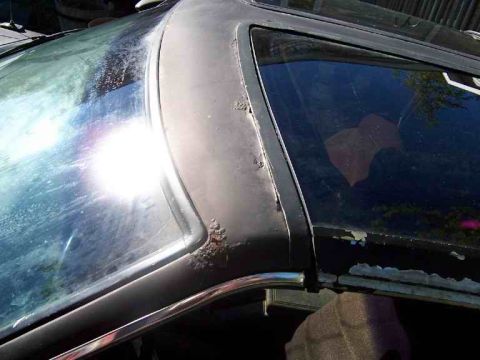 1978 Ford Mustang II - Rust is visible on the trim of a car's roofline and window frame.