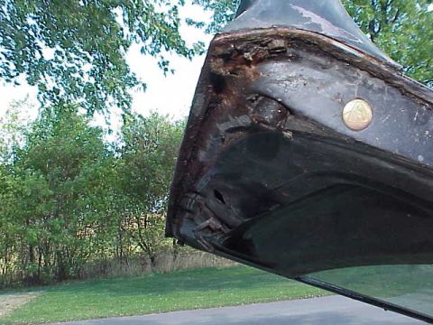 1978 Ford Mustang II - Close-up of a heavily rusted car door frame, showing significant corrosion and damage.