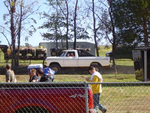 1979 Ford Bronco - A white 1979 Ford Bronco pickup truck is seen from the side during an outdoor event.