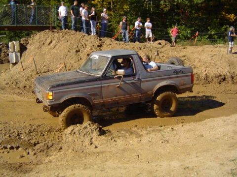 1979 Ford Bronco - This Ford Bronco tackles a challenging mud pit during an off-road event.