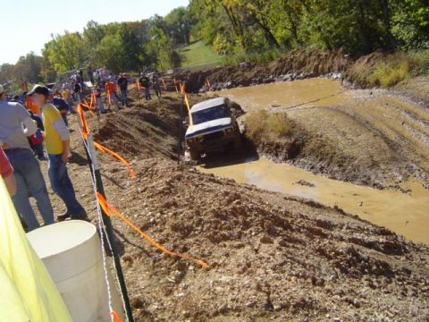 1979 Ford Bronco - An off-road SUV attempts to traverse a challenging mud course during an event.