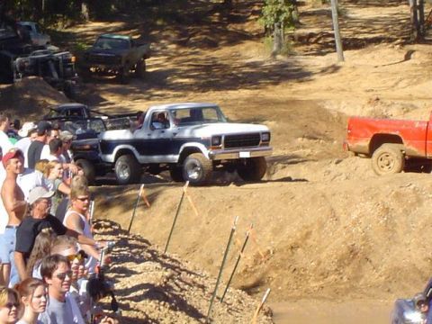 1979 Ford Bronco - Spectators watch as a 1979 Ford Bronco navigates an off-road course.