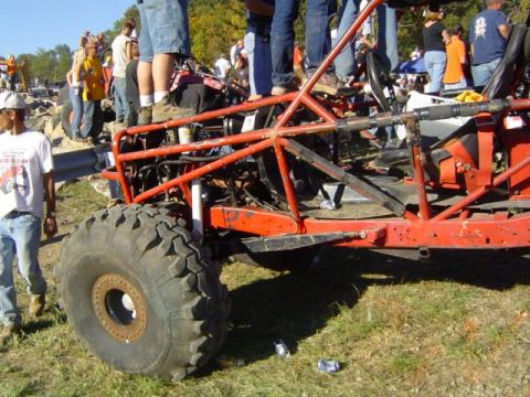 1979 Ford Bronco - This custom buggy appears to be at an off-road event with spectators standing spectators.