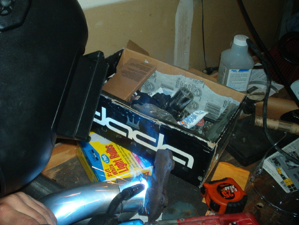 Welding an exhaust pipe with a bright spark