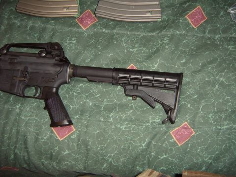 1988 Ford Bronco - AR-15 style rifle and magazines laid out on a green patterned blanket.