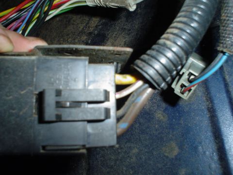 1984 Ford Bronco - Detail of a vehicle's wiring harness and electrical connector, likely part of an interior rebuild or repair.
