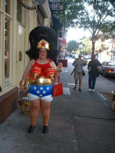 1991 Ford Bronco - A person in a Wonder Woman costume stands on a city sidewalk.