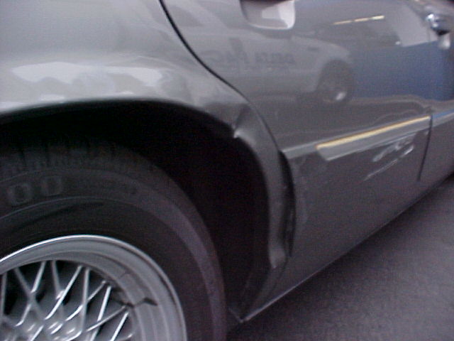 2000 Mercury Grand Marquis rear quarter panel dented near wheel well