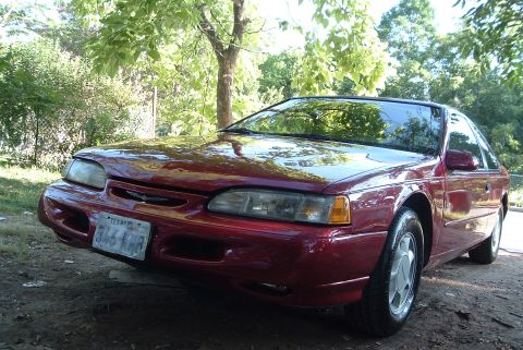 1994 Ford Thunderbird - ohhh, shiny...:D too bad the paint is toast on the roof, texas sun is not forgiving to ford's crappy clearcoats.