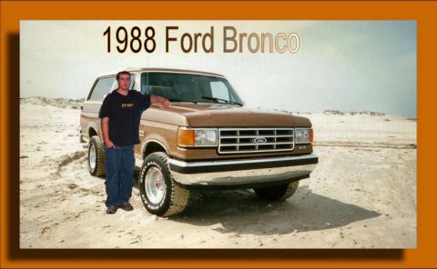 1996 Ford F-150 - A man poses with his 1988 Ford Bronco in a sandy, outdoor setting.