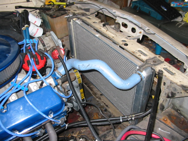 Engine bay with blue valve covers and radiator