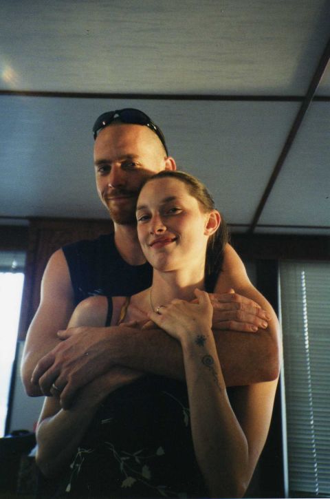2001 Ford Taurus - A couple embraces in an indoor setting, with visible text from a website watermark at the bottom of the image.