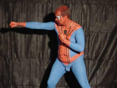 1968 Ford Mustang - A person is depicted in a full body suit painted to resemble the Marvel character Spider-Man.