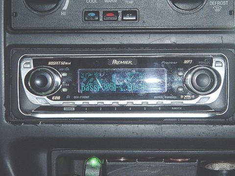 1994 Ford Thunderbird - Close-up of a Pioneer Premier car stereo, model DEH-P740MP, with visible text and controls.