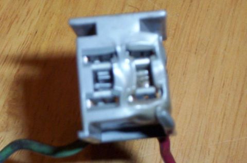 1978 Ford Mustang II - Close-up of a gray electrical connector with visible wires and the "SUPERMOTORS" logo in the corner.