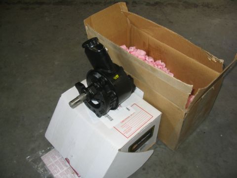 1979 Ford Bronco - A new power steering pump is shown next to its packaging.