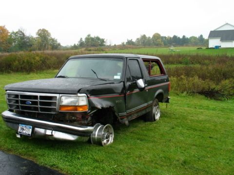 1994 Ford Bronco - This Ford Bronco has significant front-end damage and is missing a front wheel.