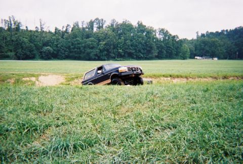 1995 Ford Bronco - A 1995 Ford Bronco is stuck in a ditch off-road.