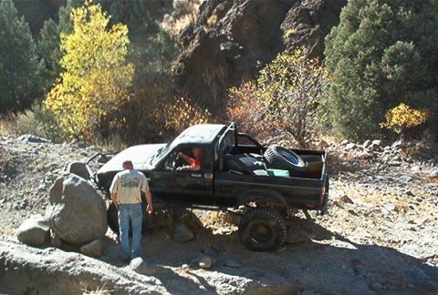 1986 Ford Bronco - Dad gives the rock a shot.