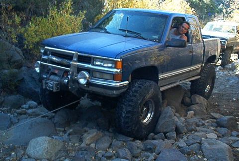 1986 Ford Bronco - A rock rolled out from under one of Bill's tires ruining his line and getting him pretty stuck on this rock.