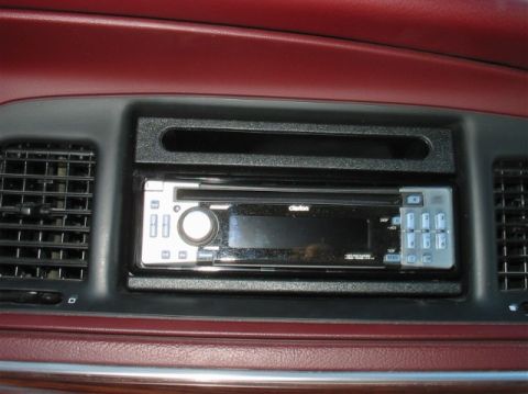 1996 Mercury Grand Marquis - Close-up of a car's dashboard showing a Clarion stereo system and air vents.