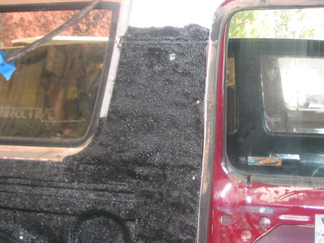 Interior door panel and window frame with black textured material