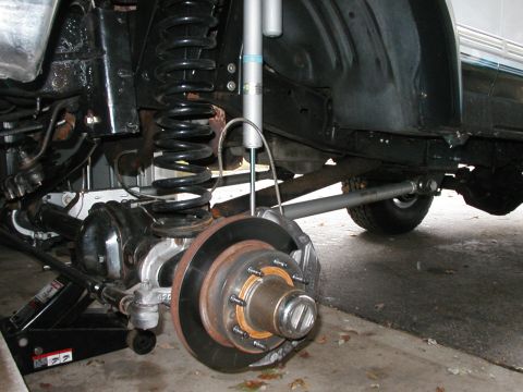 1994 Ford Bronco - Close-up view of the rear suspension and axle assembly of a 1994 Ford Bronco.