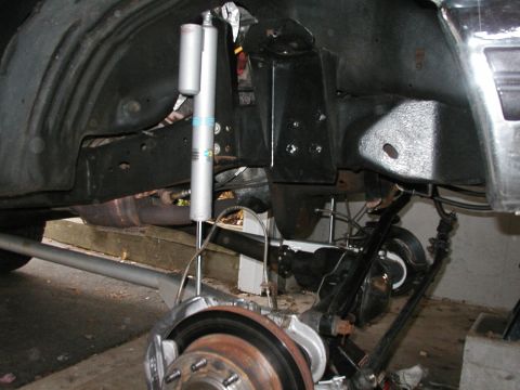 1994 Ford Bronco - Rear axle and suspension components, including a Bilstein shock absorber and brake assembly.
