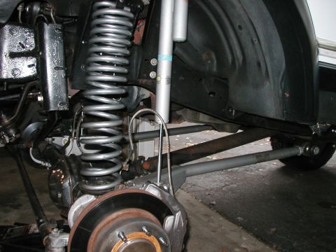 1994 Ford Bronco - Close-up of the front suspension and brake system on a 1994 Ford Bronco.