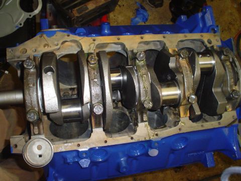 1981 Ford Bronco - Close-up view of an engine block's internal components, including the crankshaft and connecting rods.