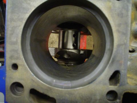 1981 Ford Bronco - Close-up view inside an engine cylinder block, showing a piston assembly.