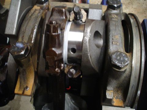 1981 Ford Bronco - Close-up view of engine crankshaft and connecting rods, showing internal engine components.