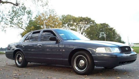 1998 Ford Crown Victoria - This 1998 Ford Crown Victoria is captured from a 3q front angle, its dark blue exterior.