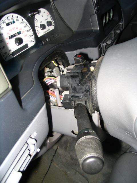 1993 Ford Taurus - Dashboard and steering column of a 1998 Ford Explorer, showing exposed wiring and gauges.