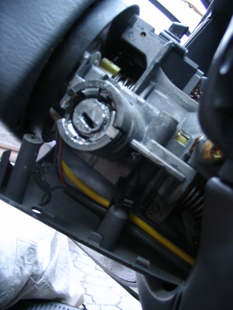 1993 Ford Taurus - Close-up view of a vehicle's ignition cylinder mechanism, showing internal components and wiring.