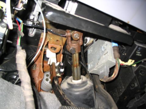1993 Ford Taurus - This image shows the interior components of a vehicle, focusing on the steering column and electrical wiring.