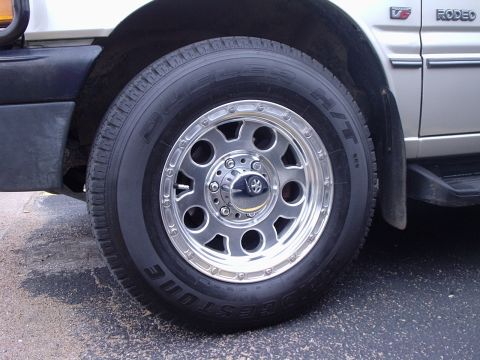 2000 Ford Taurus - Vehicle wheel and fender detail. The vehicle appears to be a Rodeo model.