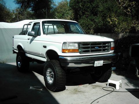 1978 Ford Bronco - This lifted Ford F-150 pickup truck features chrome wheels and aggressive off-road tires, suggesting it's ready for adventure.