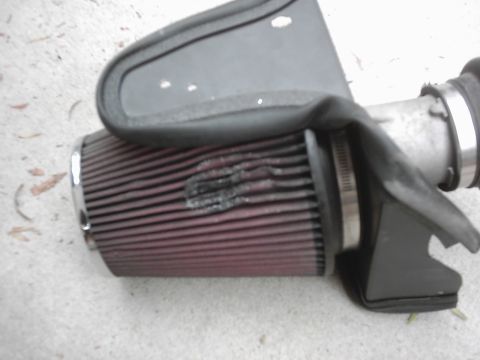 1978 Ford Bronco - Close-up of a K&N air filter assembly with intake tubing.