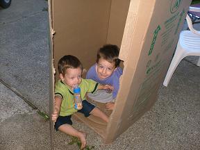 1989 Ford Bronco - Kids are having fun in a makeshift fort made from a big cardboard box.